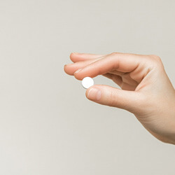 hand holding pill for oral conscious sedation